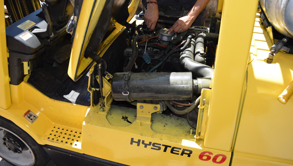 Forklift repair going on up close on a forklift.