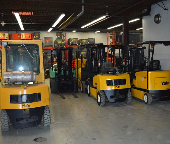 Advantage Material Handling's warehouse, full inventory with scissor lift rental options.